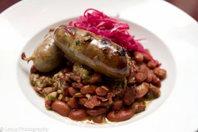 House-made boudin over confit pork, smokey beans, topped with pickled red cabbage