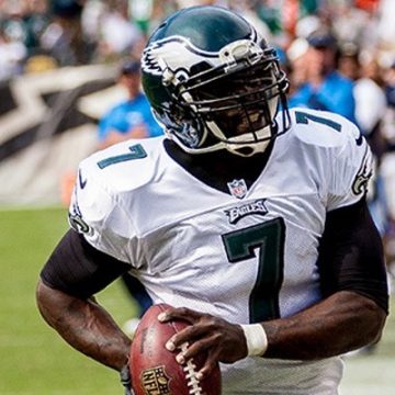 Mike Vick running with football on sideline