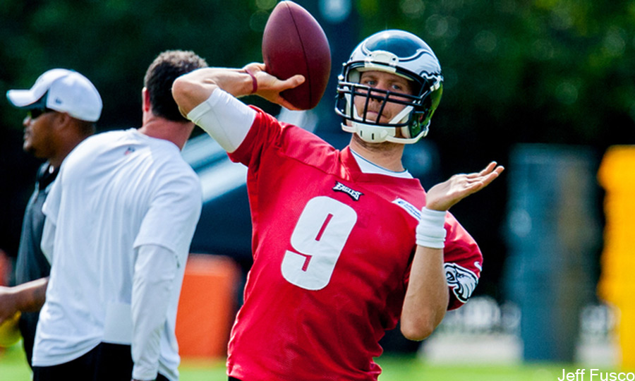 Eagles QB Nick Foles in red practice jersey preseason throwing