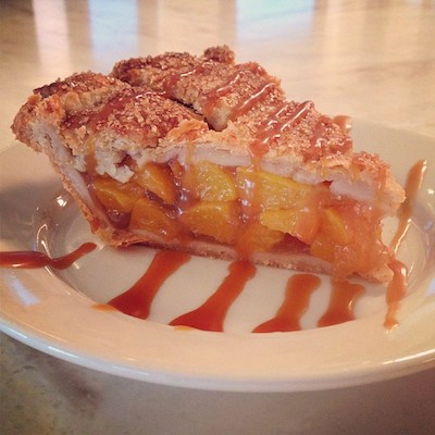 A slice of Bourbon Caramel Peach Pie at Magpie, our choice for Best Sweet Treats.