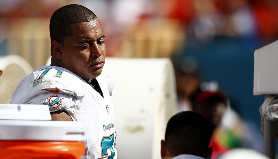 Miami Dolphins tackle Jonathan Martin (71) on the sideline in the second half of a game against the Buffalo Bills at Sun Life Stadium. | Robert Mayer-USA TODAY Sports