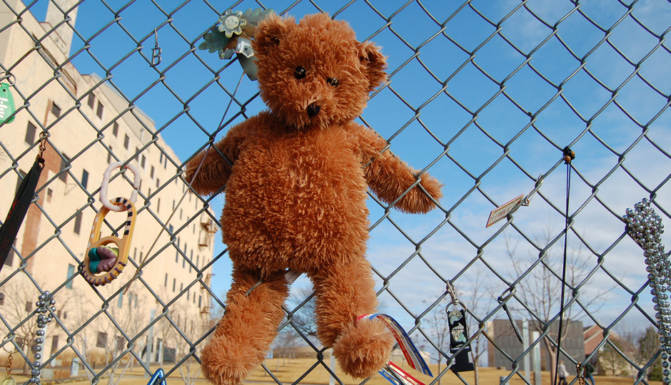 Teddy Bear on Fence at Oklahoma City National Memorial. Photo | Shutterstock.com