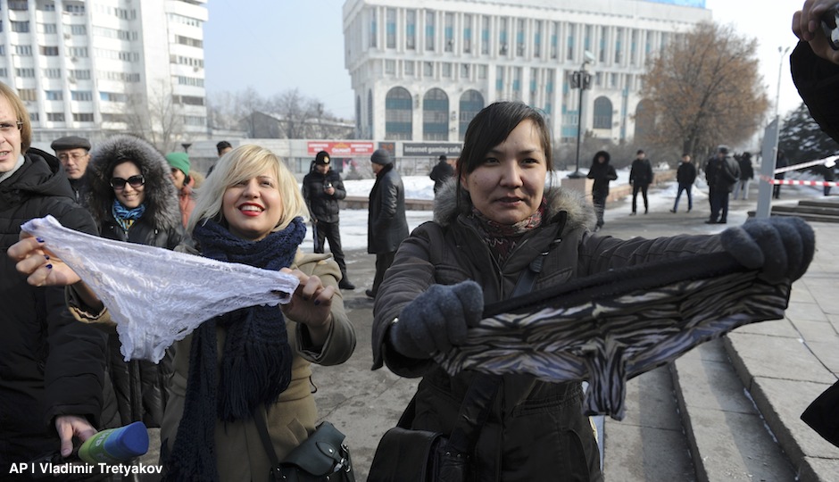 This photo taken on Sunday, Feb. 16, 2014, shows women during a protest against the ban of lace underwear  in Almaty, Kazakhstan. A trade ban on synthetic underwear has Russia and her economic allies with their knickers in a twist. Post-Soviet consumers reacted with dismay to news that synthetic underwear will be banned within the Eurasian Economic Commission, which regulates a customs union between Russia, Belarus and Kazakhstan, from July 1. Consumer outcry against the restrictions reached a fever pitch after a Sunday protest in the capital of Kazakhstan, where thirty women wore lace underwear on their heads and shouted “Freedom to panties!” as they were shoved into police vehicles. (AP Photo/Vladimir Tretyakov)