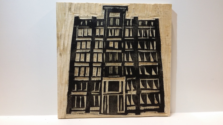 Etching of the Asian Arts Initiative's Gilbert Building on wood. 