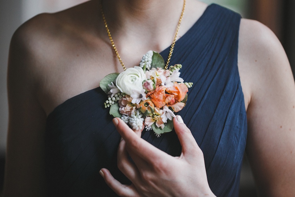 A fresh-flower necklace from Love 'n Fresh Flowers, photographed by Love Me Do Photography. 
