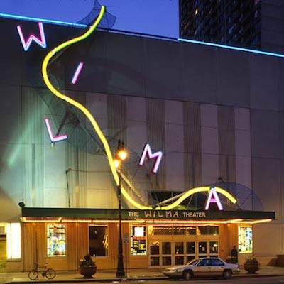 The Wilma Theater lit up at night. 
