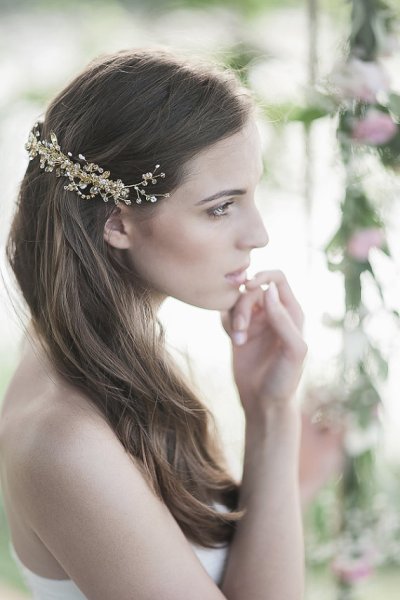 This beautiful gold comb gets a touch of sparkle from Swarovski crystals and freshwater pearls.