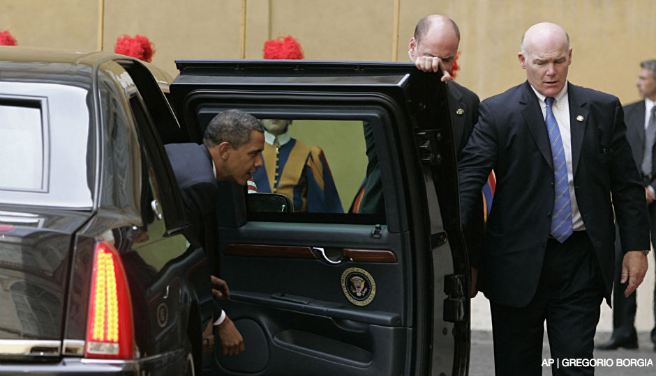 In this July 10, 2009 file photo, Secret Service Agent Joseph Clancy, right, holds the door open for President Barack Obama upon arrival at the Vatican for a meeting with Pope Benedict XVI. Secret Service Director Julia Pierson resigned Wednesday, a day after bitingly critical questioning by Congress about a White House security breach. There had been increasing calls for her departure during the day. Pierson will be replaced by Clancy, a former special agent in charge of the president's protective detail who retired in 2011. 