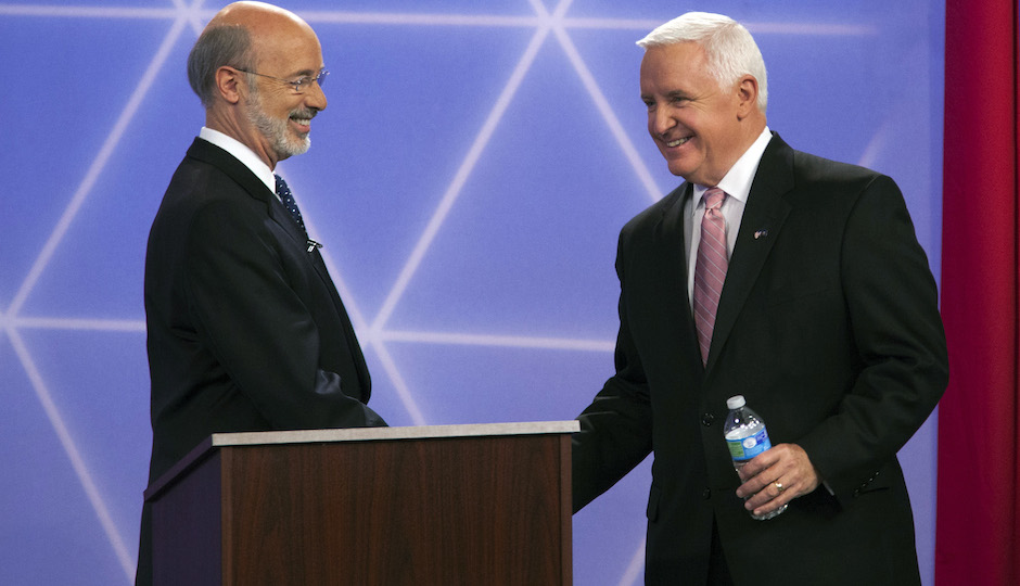 Democratic party candidate for governor of Pennsylvania, Tom Wolf, left, and republican Gov. Tom Corbett before a debate at the WTAE-TV studio in Wilkinsburg, Pa. on Wednesday, Oct. 8, 2014. (AP Photo/Rodney Johnson,WTAE-TV, Pool)