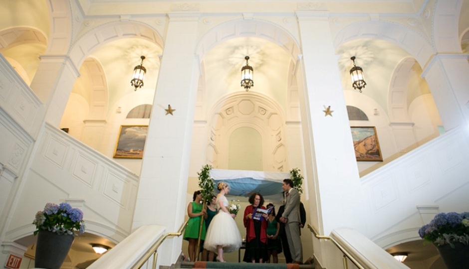 Exchange vows at the top of the Swedish Museum's grand staircase. Photo by Peach Plum Pear Photography.