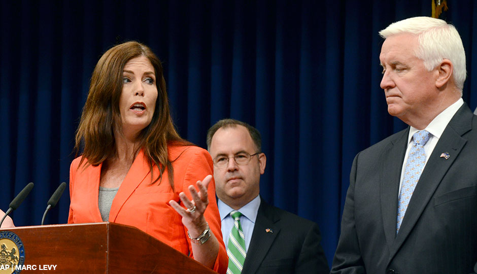 Attorney General Kathleen Kane gestures to Gov. Tom Corbett while speaking at a news conference in Harrisburg in June. 