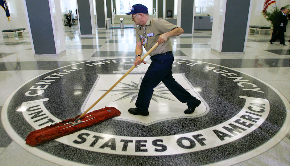In this March 3, 2005 file photo, a workman slides a dustmop over the floor at the Central Intelligence Agency headquarters in Langley, Va. Senate investigators have delivered a damning indictment of CIA interrogation practices after the 9/11 attacks, accusing the agency of inflicting pain and suffering on prisoners with tactics that went well beyond legal limits. The torture report released Tuesday by the Senate Intelligence Committee says the CIA deceived the nation with its insistence that the harsh interrogation tactics had saved lives. It says those claims are unsubstantiated by the CIA's own records. (AP Photo/J. Scott Applewhite) 