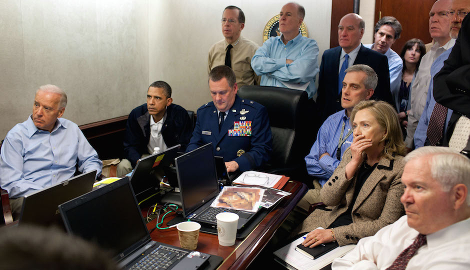 President Barack Obama and Vice President Joe Biden, along with with members of the national security team, receive an update on the mission against Osama bin Laden in the Situation Room of the White House, May 1, 2011. Please note: a classified document seen in this photograph has been obscured. (Official White House Photo by Pete Souza) 