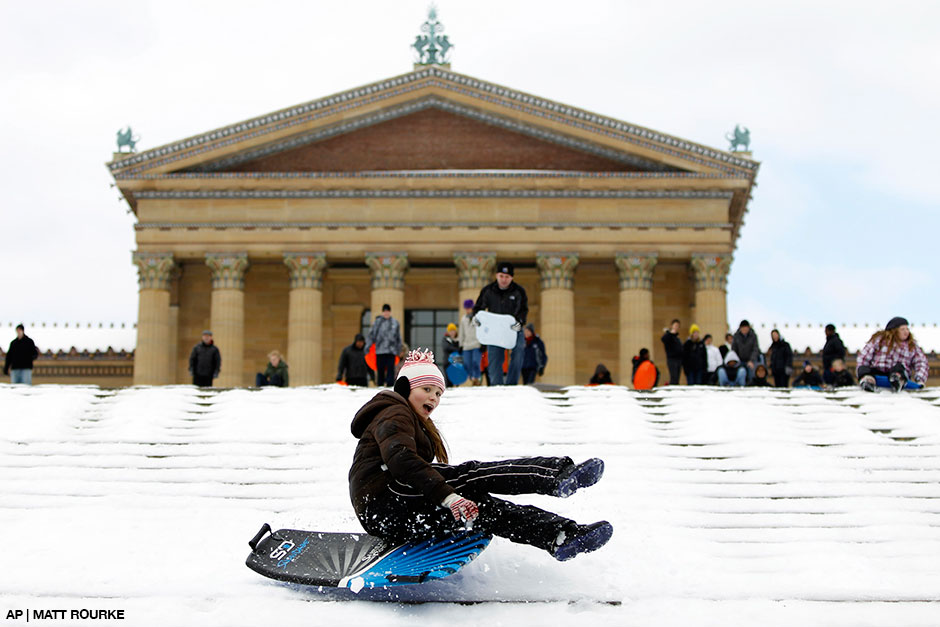 Gonna fly now: Hayden Tomaszewski sleds down the steps of the Philadelphia Art Museum in January 2011 | Photograph by Matt Rourke, AP