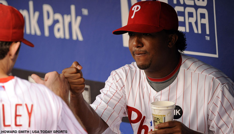 Philadelphia Phillies pitcher Pedro Martinez (45) greets second baseman Chase Utley (26) in the dugout prior to the game against the Colorado Rockies at Citizens Bank Park in August of 2009.