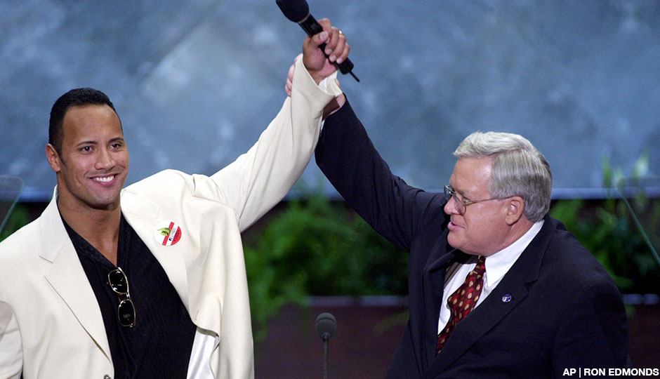 House Speaker Dennis Hastert and World Wrestling Federation champion The Rock raise their hands at the podium at the Republican National Convention in Philadelphia on August 2nd, 2000.