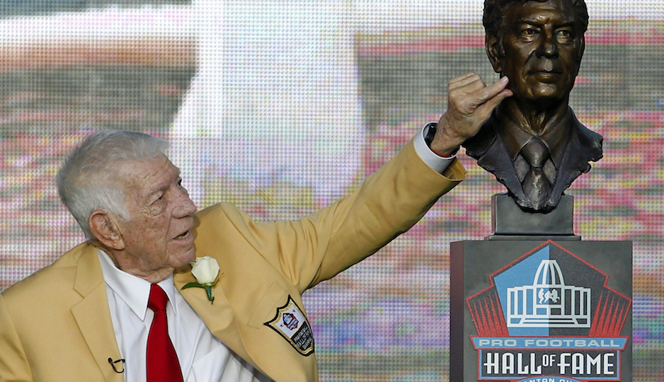 Ed Sabol touches his bust after  it was unveiled during the induction ceremony at the Pro Football Hall of Fame Saturday, Aug. 6, 2011, in Canton, Ohio. (AP Photo/Ron Schwane)