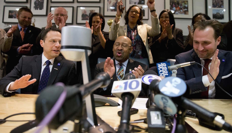 Philadelphia Mayor Michael Nutter, center, reacts during a conference call with Democratic National Committee Chair Rep. Debbie Wasserman Schultz and other officials, Thursday, Feb. 12, 2015, at City Hall in Philadelphia. Democrats have selected Philadelphia as the site of the party's 2016 national convention, choosing a patriotic backdrop for the nomination of its next presidential candidate. The convention will be held the week of July 25, 2016  (AP Photo/Matt Rourke)