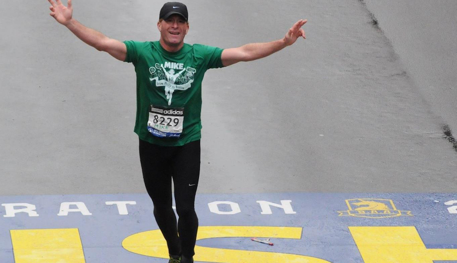 Montco dad Mike Rossi crosses the Boston Marathon finish line.
