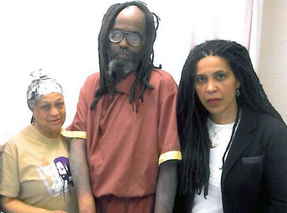Mumia Abu-Jamal (center) with MOVE's Pam Africa (left) and Mumia supporter Johanna Fernandez (right), via Facebook