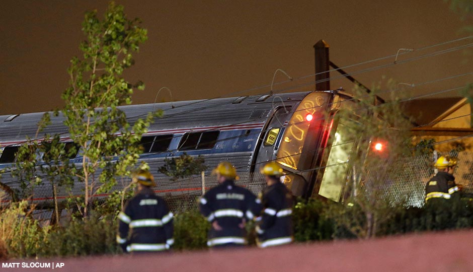 Emergency personnel work the scene of a train wreck, Tuesday, May 12, 2015, in Philadelphia. An Amtrak train headed to New York City derailed and crashed in Philadelphia. 