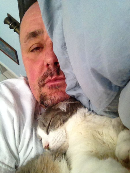 NOORD's Joncarl Lachman napping with his cat Vincent.