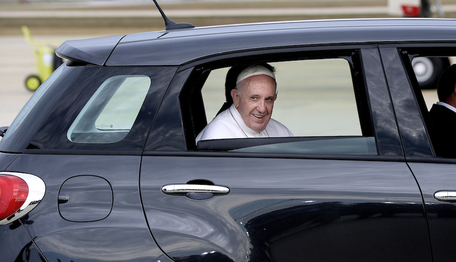 His Holiness Pope Francis is being transported to Washington D.C in a Fiat 500 at Joint Base Andrews in Maryland on September 22, 2015. The Pope is making his first trip to the United States on a three-city, five-day tour that will include Washington, D.C., New York City and Philadelphia. Credit: Olivier Douliery / Photo by: Olivier Douliery/picture-alliance/dpa/AP Images