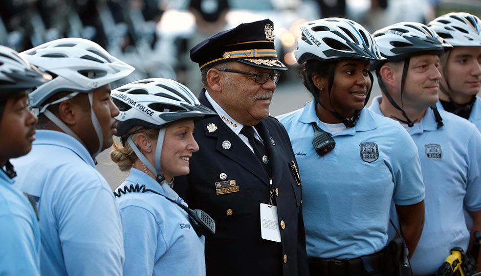 Philadelphia Police Commissioner Charles Ramsey poses with other police officers Saturday, Sept. 26, 2015, in Philadelphia. (AP Photo/Pablo Martinez Monsivais, Pool)