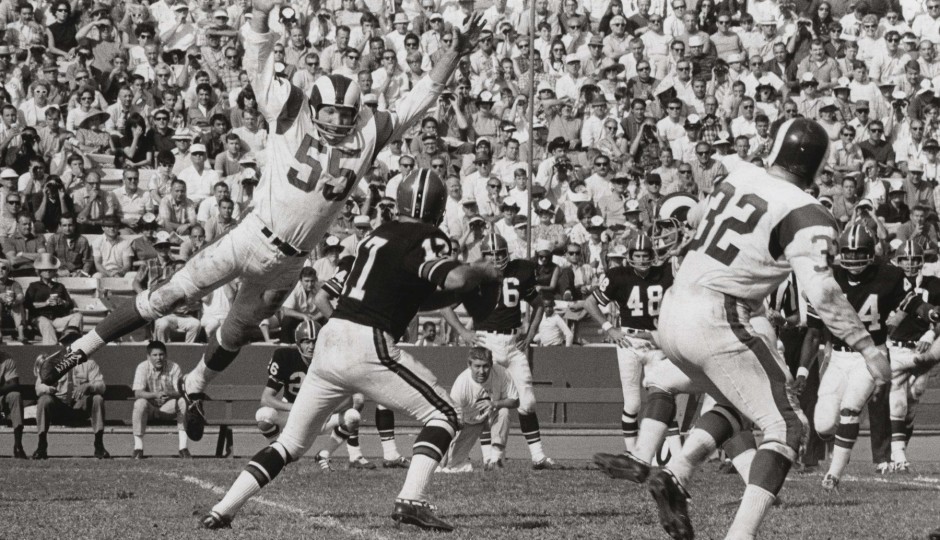Maxie Baughan, playing for the Los Angeles Rams in 1968, pressures the quarterback. (Photo courtesy of USA Today Sports)
