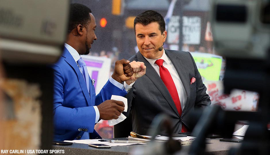 Desmond Howard and Rece Davis fist bump moments before the live broadcast of ESPN College GameDay at Sundance Square. 