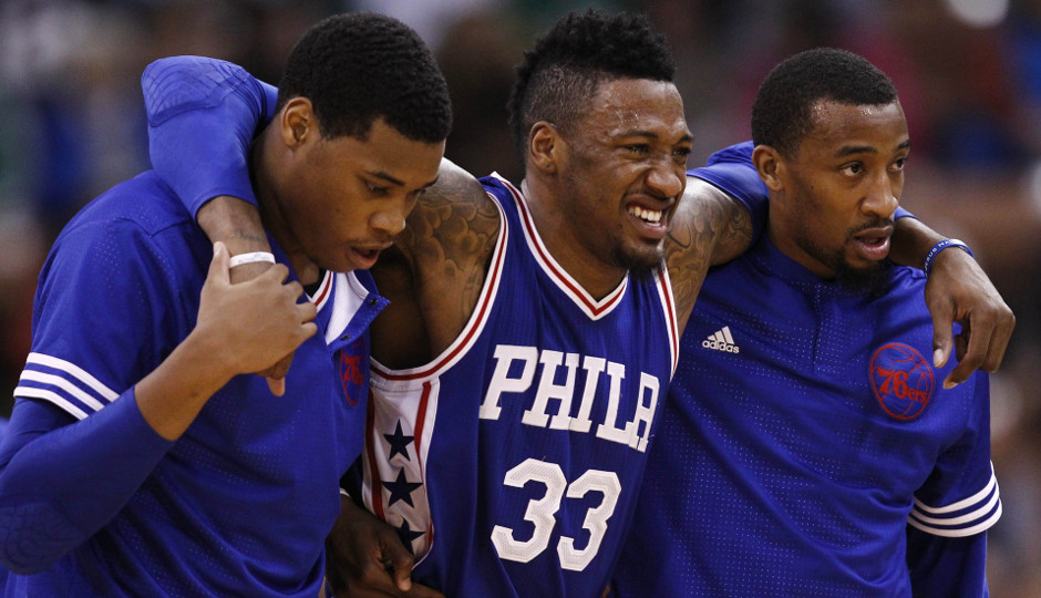 Sixers forward Robert Covington is helped off the floor after suffering a right knee sprain in Friday's preseason finale against the Celtics | Mark L. Baer-USA TODAY Sports