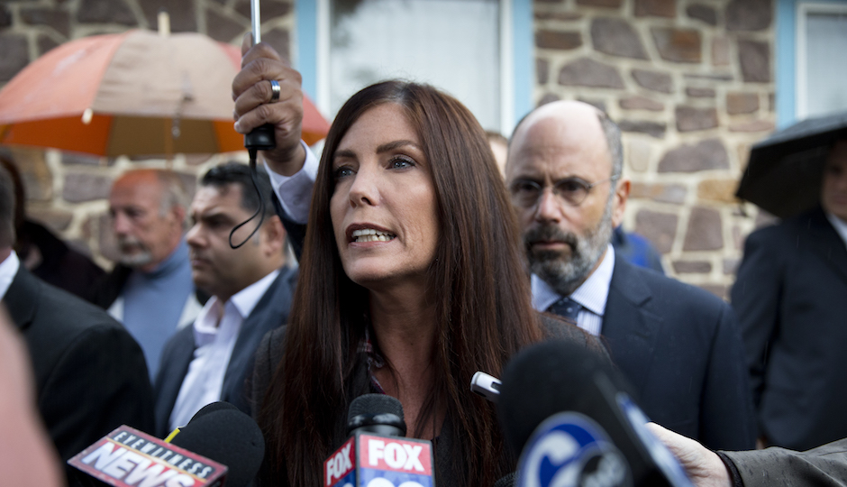 Pennsylvania Attorney General Kathleen Kane speaks with members of the media after her arrangement before a district judge, Thursday, Oct. 1, 2015, in Collegeville, Pa. Prosecutors added a new perjury count and other criminal charges Thursday against Kane, saying they found a signed document that contradicts her claims she never agreed to maintain secrecy of a grand jury investigation in 2009, before she took office. The Montgomery County district attorney charged her with felony perjury and two misdemeanors — false swearing and obstruction — based on a signed secrecy oath she signed shortly after taking office in early 2013. AP Photo/Matt Rourke)