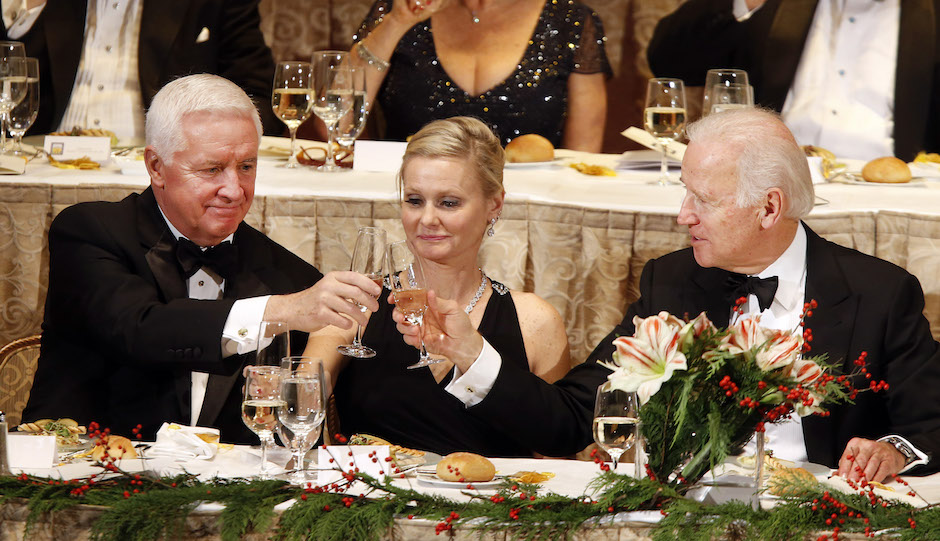 Then-Pennsylvania Gov. Tom Corbett, left, toasts with Vice President Joe Biden as Annie Coons, wife of Delaware Sen. Chris Coons, looks on during the annual dinner of the Pennsylvania Society at the Waldorf-Astoria hotel Saturday, Dec. 14, 2013, in New York. (AP Photo/Jason DeCrow)