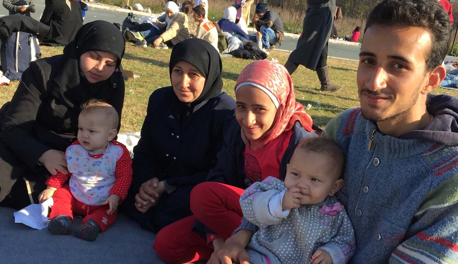 25-year-old Zachariah Kwirah (right), a factory worker from Syria, said he was almost separated from his family of three babies, two sisters and mother-in-law at a Serbian processing camp. Issue date: Monday November 16, 2015. Photo credit should read: Michael McHugh/PA Wire