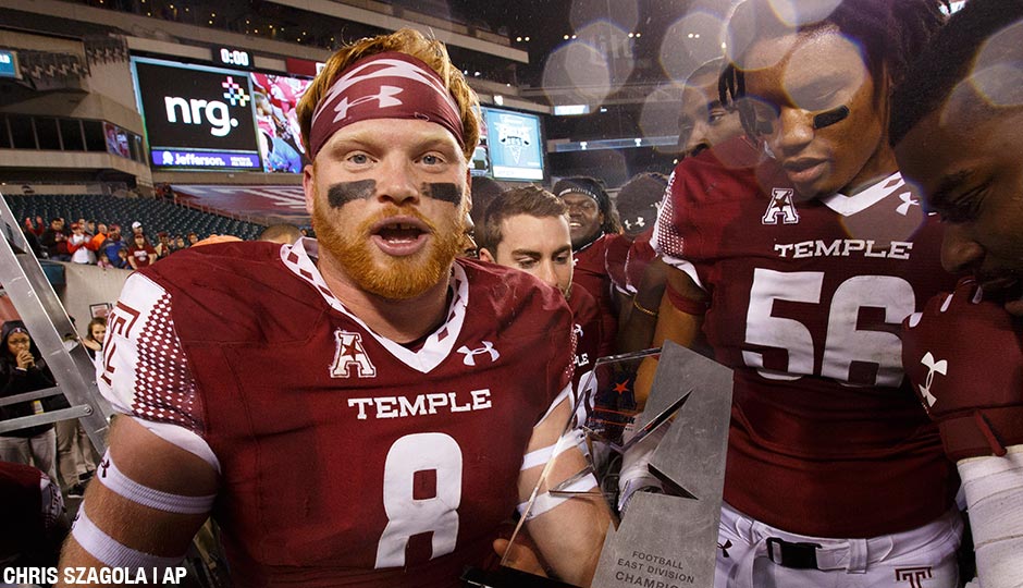 Temple linebacker Tyler Matakevich (8) holds the American Conference East Division Trophy following the second half of an NCAA college football game against Connecticut, Saturday, Nov. 28, 2015, in Philadelphia. Temple won 27-3.