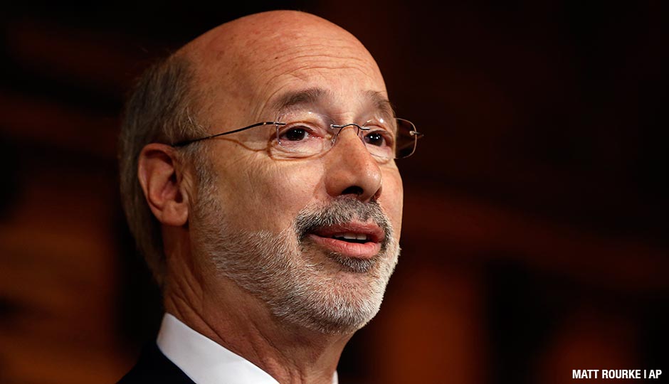 Pennsylvania Gov. Tom Wolf speaks with members of the media Tuesday, Dec. 29, 2015, at the state Capitol in Harrisburg, Pa. Wolf says he is rejecting parts of a $30.3 billion state budget plan that's already a record six months overdue, but he's freeing up over $23 billion in emergency funding.