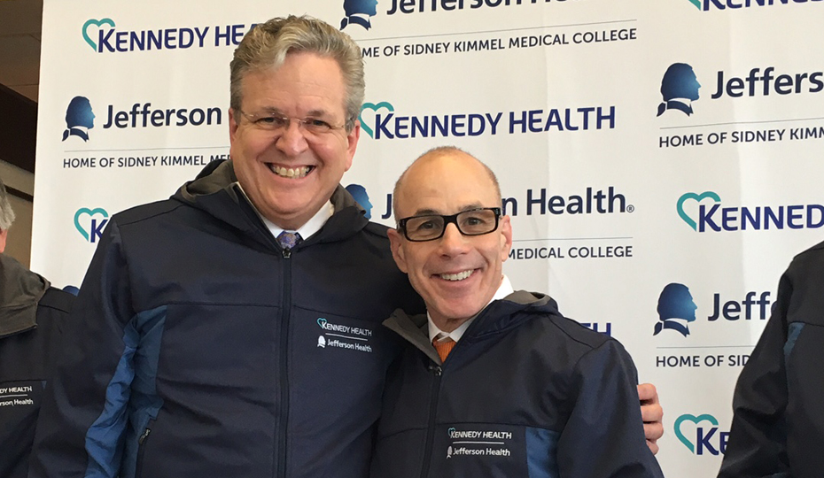 Joseph Devine (left) with Dr. Stephen Klasko announcing the merger between Jefferson and Kennedy Health.