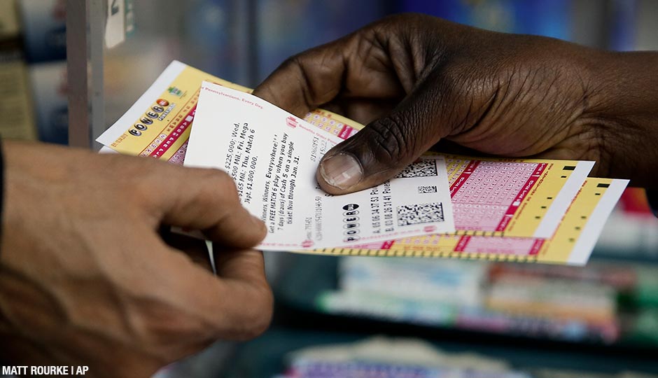A person purchase Powerball lottery tickets from a newsstand Wednesday, Jan. 6, 2016, in Philadelphia. Players will have a chance Wednesday night at the biggest lottery prize in nearly a year. 
