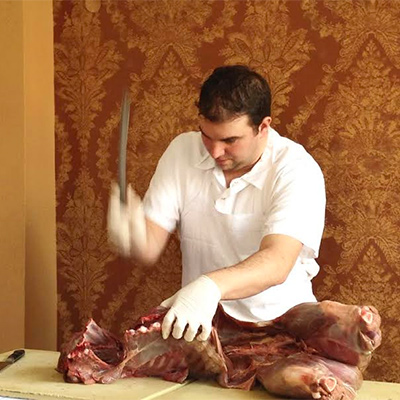 Josh Lawler demonstrating butchering technique.