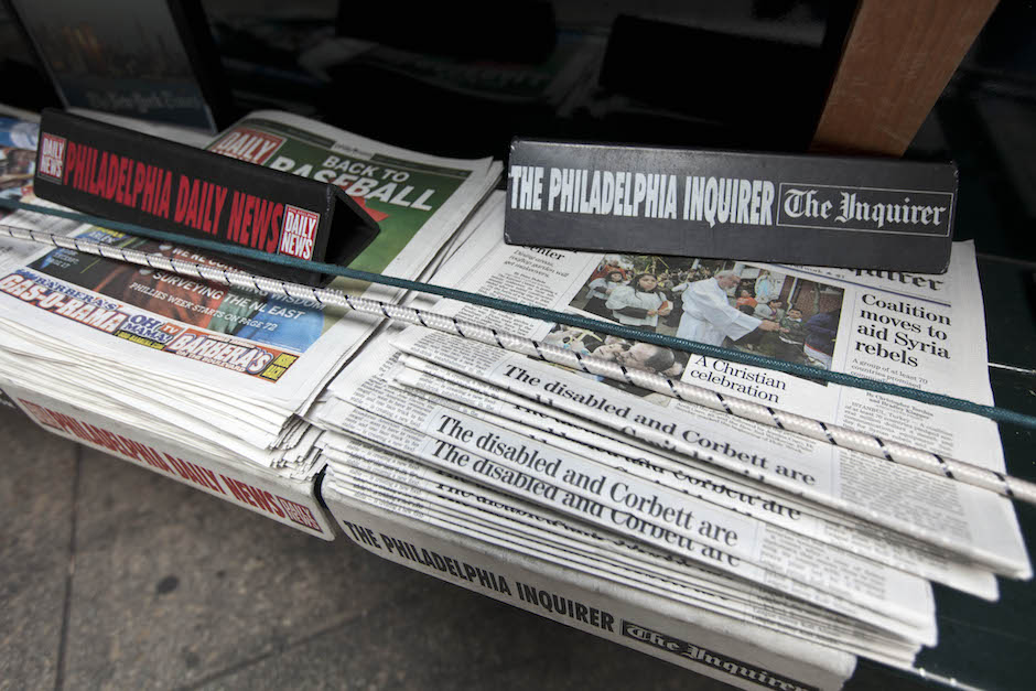 The Philadelphia Inquirer and Philadelphia Daily News newspapers sit on display on a newsstand in Philadelphia. (AP Photo/Matt Rourke)