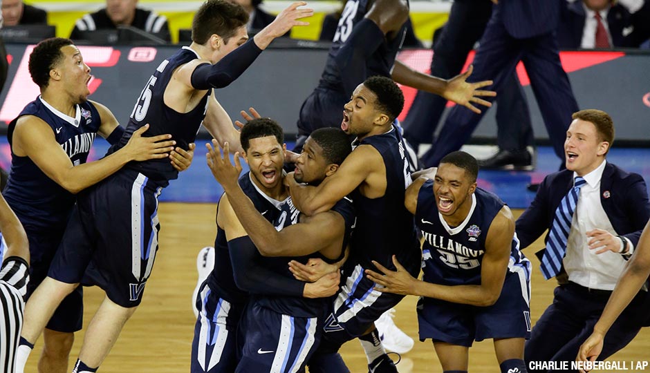 Villanova players celebrates after Kris Jenkins, center, scores a game winning three point basket in the closing seconds of NCAA Final Four tournament college basketball championship game.