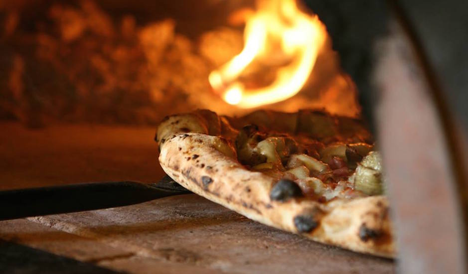 Pizza oven at Capofitto | Photo via Facebook