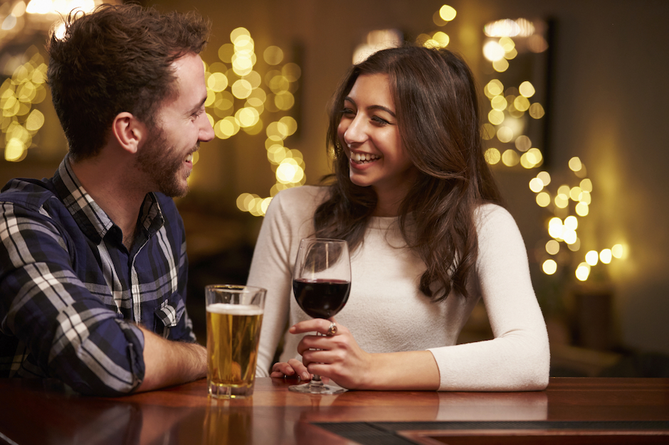 Couple enjoying drinks on a first date