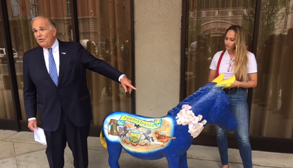 Former Governor Ed Rendell looks at the donkey painted for the Pennsylvania delegation.