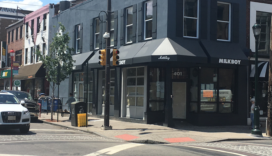 This photo shows the new MilkBoy South location at 4th and South streets in Philadelphia. It's the site of a controversy because of a dumpster parked in front of it. The dumpster is also seen in the photo.