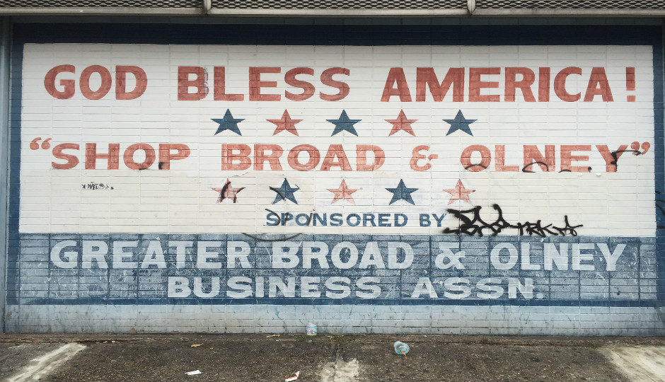 A faded sign near Broad & Olney, 12 miles from the DNC at the Wells Fargo Center.