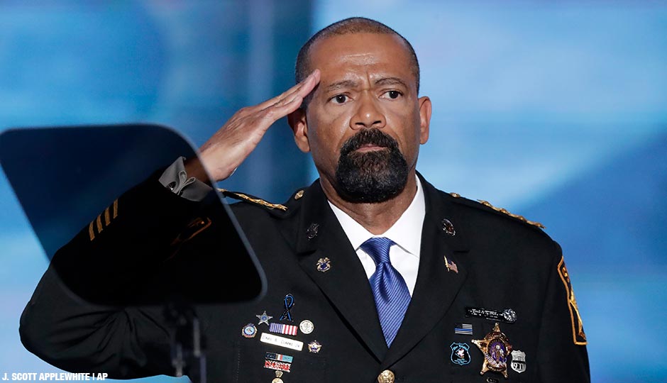 David Clarke, Sheriff of Milwaukee County, Wis., salutes after speaking during the opening day of the Republican National Convention in Cleveland. 