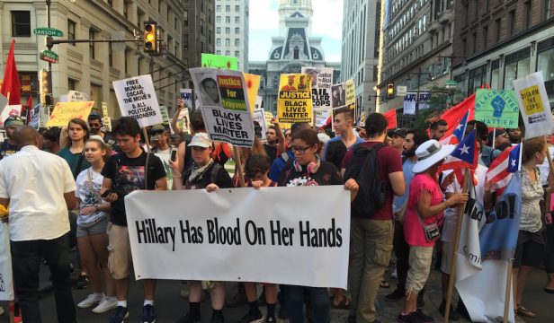 Protestors march protesting police brutality and Hillary Clinton after a rally at City Hall. 