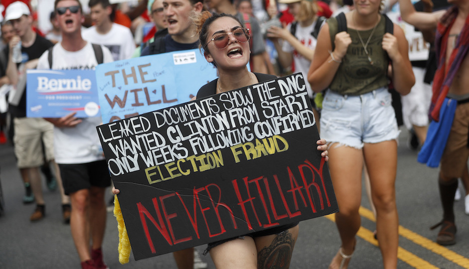 Supporters of Sen. Bernie Sanders, I-Vt., march during a protest in downtown Philadelphia, Monday, July 25, 2016, on the first day of the Democratic National Convention. On Sunday, Debbie Wasserman Schultz announced she would step down as DNC chairwoman at the end of the party's convention, after emails presumably stolen from the DNC by hackers were posted to the website Wikileaks. (AP Photo/John Minchillo)