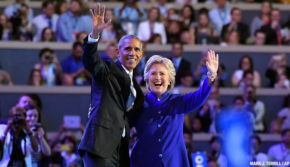 President Barack Obama and Democratic Presidential candidate Hillary Clinton wave together during the third day of the Democratic National Convention in Philadelphia , Wednesday, July 27, 2016.